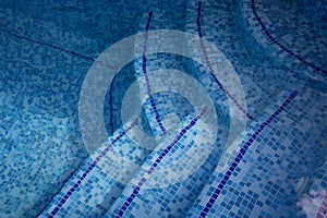 Stairs of the swimming pool under water. Design of the swimming pool.