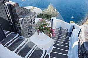 Stairs to the aegean sea in Santorini village of Oia