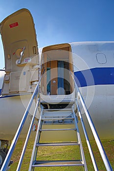 Stairs to the aircraft - forward airplane entry door open y