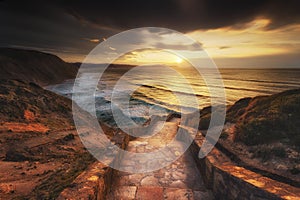 Stairs to the Barrika beach at sunset