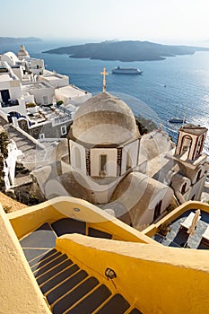 Stairs to the Church of St. John the Theologian in typical greek village along the ocean in Fira, Santorini, Greece