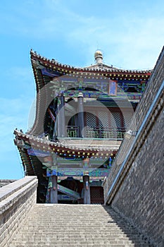 Stairs to the city wall of Xian city against the blue sky. Old town. Xian.