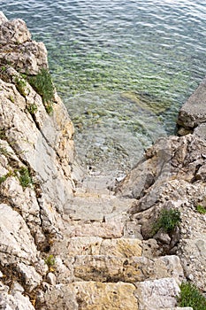 Stairs to the crystal clear sea