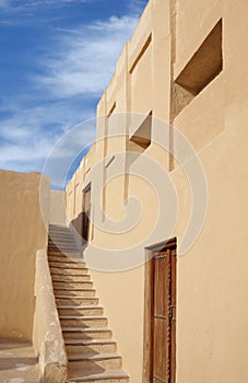 Stairs to the II level of porch in Riffa fort