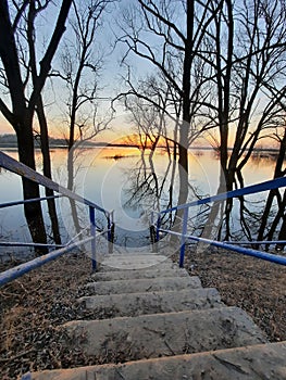 Stairs to the river at sunset