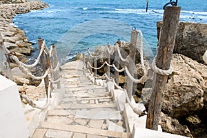 Stairs to the sea in rocky outcrops coast. Mahdia. Tunisia