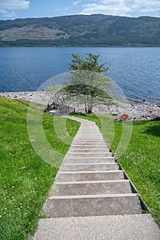 Stairs walking path down to Loch ness Lake, vertical shot, Scotland