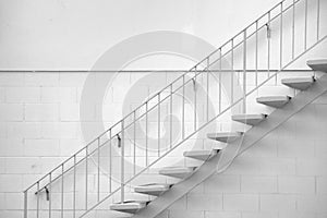 Stairway, Concrete stairs with metal banister on white brick wall, Minimal architecture pattern for simplicity.