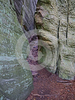 Stairway through a Crack between Rocks on the Mullerthal Trail in Berdorf, Luxembourg photo