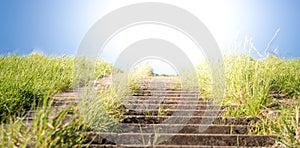 Stairway on a dike at sunset.