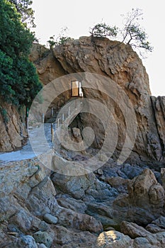 Stairway entrance into a face rocky mountain part of a non-exis