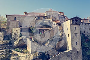 Stairway leading into a monastery build on a rock.