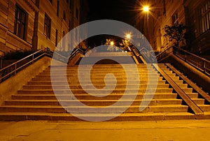 Stairway in the light of street lamps