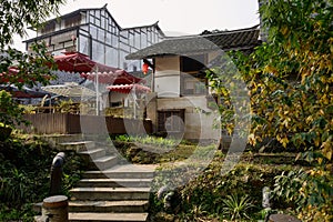 Stairway before old tile-roofed houses