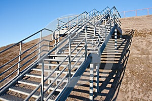 Stairway of stainless steel to the blue sky