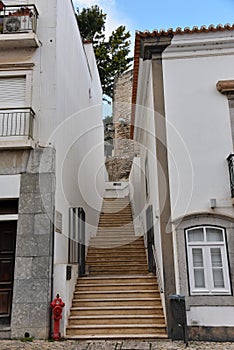 Stairway to castle in typical street in Tavira, Algarve, Portugal