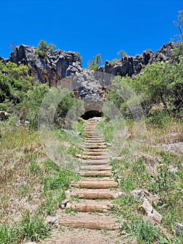 Stairway to a cave entrance in a hill