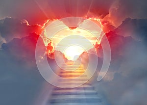 Stairway to Heaven.Stairs in sky. Concept with sun and clouds. Religion background. Red heart shaped sky at sunset. Love