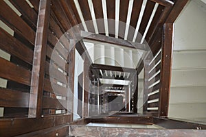 a stairway with wooden banisters