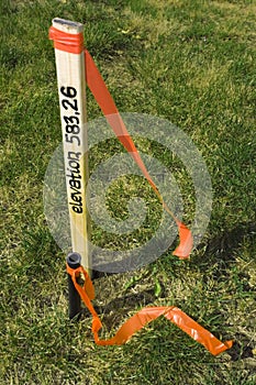 Stake with elevation