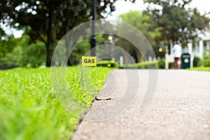 Gas line survey marking stake flag buried underground utility photo