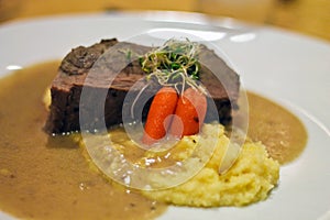 Stake and mashpotatoes in a white plate