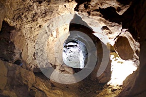 a stalactite cave with a hole in the middle