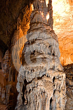 Stalactite column in cave photo