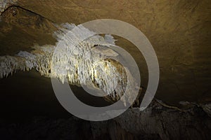 Stalactite formation on the cave ceiling