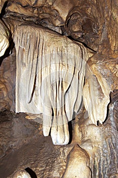 Stalactite formation in karst cave