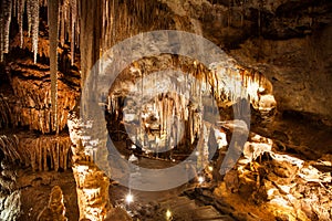 Stalactite and Stalagmite Formations in the Cave photo