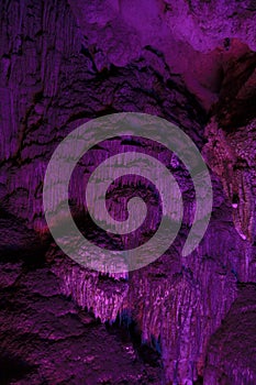 Stalactite and stalagmite formations in a limestone cave of Halong Bay