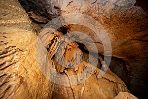 Stalactite and stalagmite and other formations inside a beautiful cave.