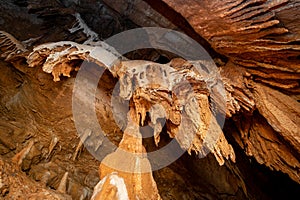 Stalactite and stalagmite and other formations inside a beautiful cave.