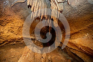 Stalactite and stalagmite and other formations inside a beautiful cave.