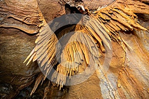 Stalactite and stalagmite and other formations inside a beautiful cave.