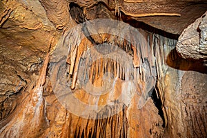 Stalactite and stalagmite and other formations inside a beautiful cave.