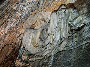 Stalactite wall in Valporquero`s cave in Leon Spain