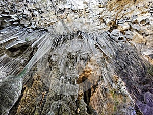 Stalactites on the cave`s ceiling