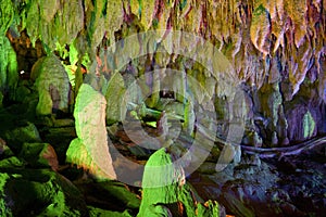 Stalactites and stalagmites in cave photo