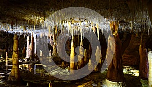 Stalactites and stalagmites in a cave photo