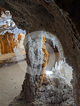 Stalactites and Stalagmites forming pillars in salt mine.