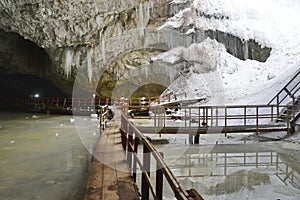 Stalactites and walking wooden floors at the entrance the Scarisoara cave, Romania