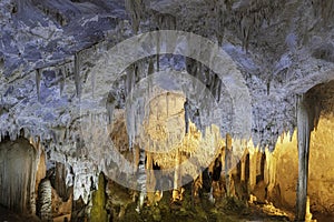 stalagmite in cave and walkway