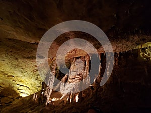 Stalagtites and stalagmites in underground cave photo