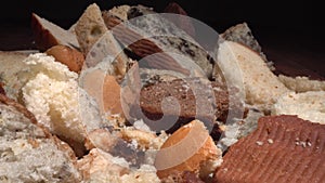 Stale bread, food wasting, food loss. Discarded moldy bread close up. Growth of toxic black mold