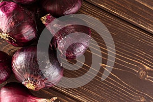 Stale red onion on brown wood