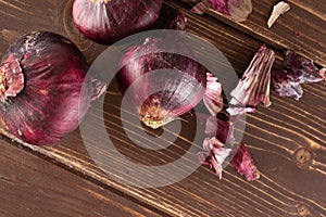 Stale red onion on brown wood