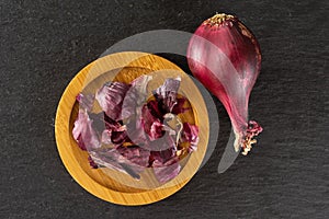 Stale red onion on grey stone