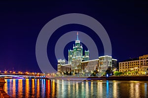 Stalin Skyscraper on Kotelnicheskaya Embankment of the Moscow River. Night shot of Moscow river reflection